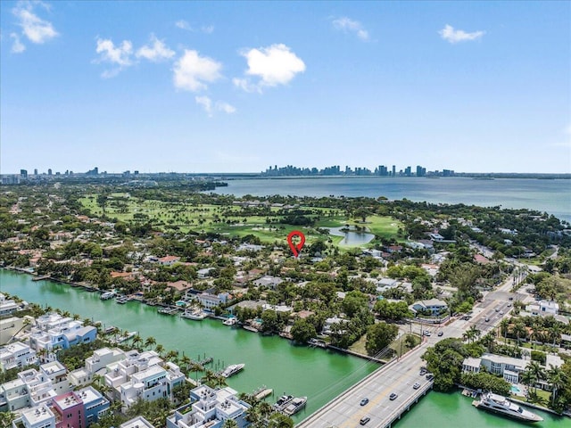 drone / aerial view with a city view and a water view