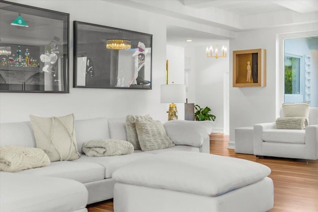 living room featuring a chandelier and wood finished floors