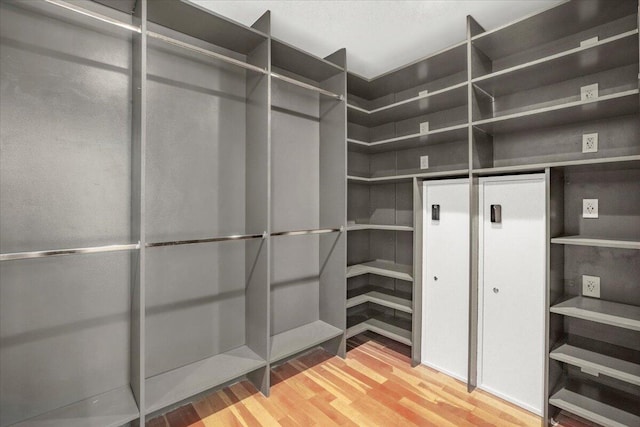 6100 La Gorce Dr, Miami Beach, FL 33140 - walk in closet with wood finished floors