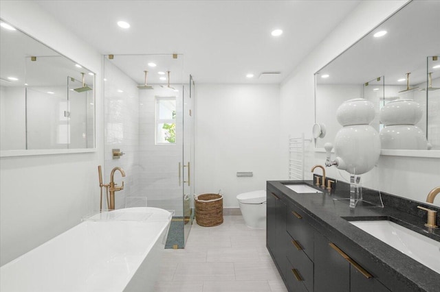 6100 La Gorce Dr, Miami Beach, FL 33140 - full bathroom featuring a stall shower, a soaking tub, recessed lighting, double vanity, and toilet