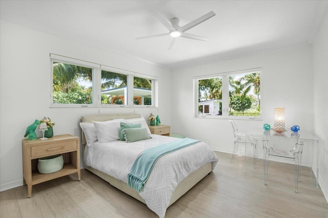 6100 La Gorce Dr, Miami Beach, FL 33140 - bedroom featuring light wood-style floors, baseboards, and a ceiling fan