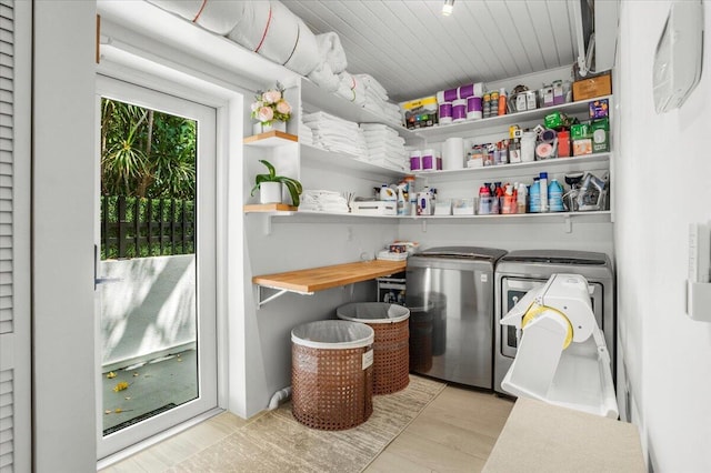 storage area with washing machine and dryer