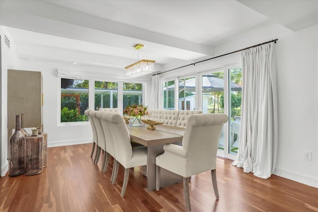 6100 La Gorce Dr, Miami Beach, FL 33140 - dining space featuring plenty of natural light, baseboards, and wood finished floors