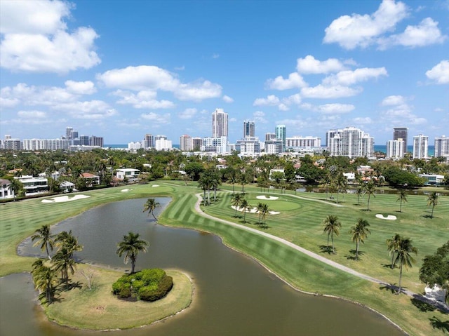 aerial view with a water view, a view of city, and view of golf course