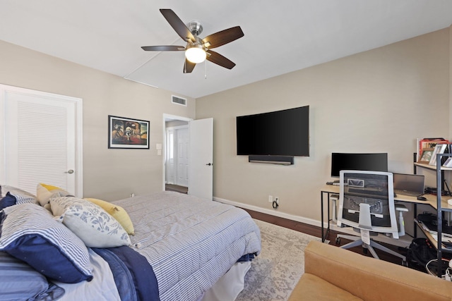 730 Greensward Ct Unit 203J, Delray Beach, FL 33445 - bedroom with baseboards, wood finished floors, ceiling fan, and a desk