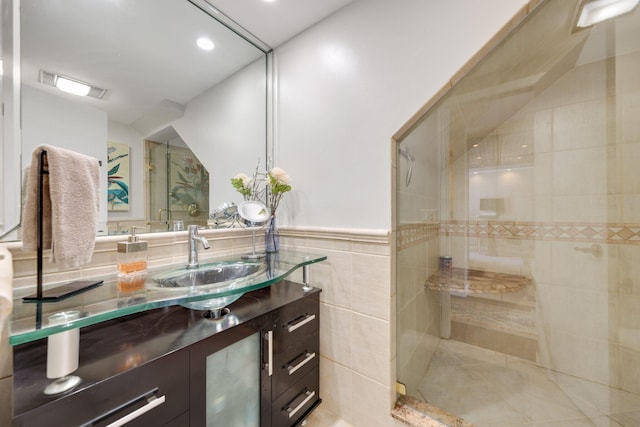 730 Greensward Ct Unit 203J, Delray Beach, FL 33445 - bathroom featuring a tile shower, vanity, recessed lighting, and tile walls