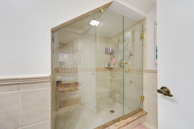 730 Greensward Ct Unit 203J, Delray Beach, FL 33445 - bathroom with a shower stall and tile walls
