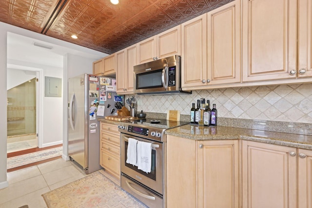 730 Greensward Ct Unit 203J, Delray Beach, FL 33445 - kitchen with stainless steel appliances, light brown cabinetry, an ornate ceiling, tasteful backsplash, and light tile patterned flooring