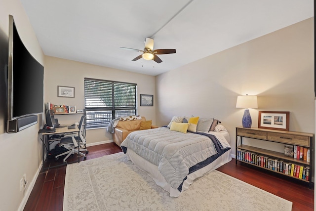 730 Greensward Ct Unit 203J, Delray Beach, FL 33445 - bedroom with dark wood-style floors, baseboards, a desk, and a ceiling fan