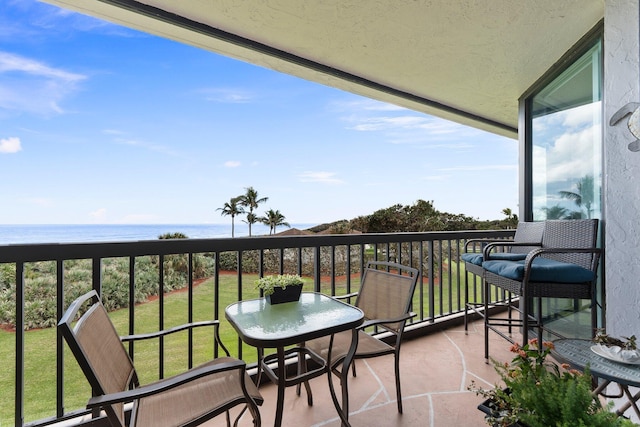 balcony featuring a water view