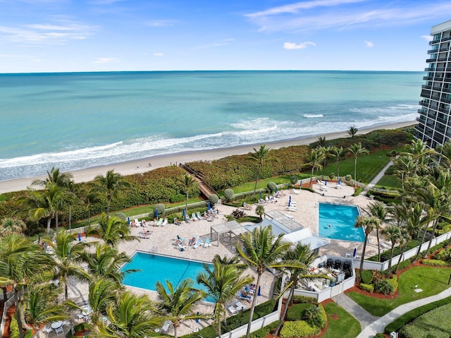aerial view with a view of the beach and a water view