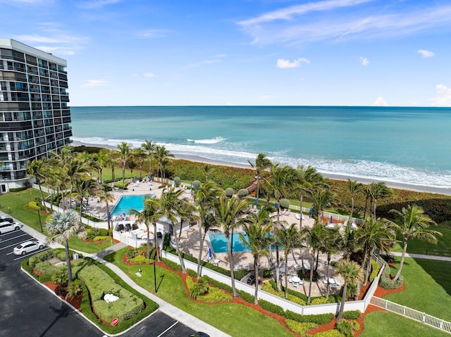 bird's eye view featuring a water view and a view of the beach