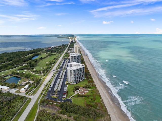 drone / aerial view featuring a view of the beach and a water view