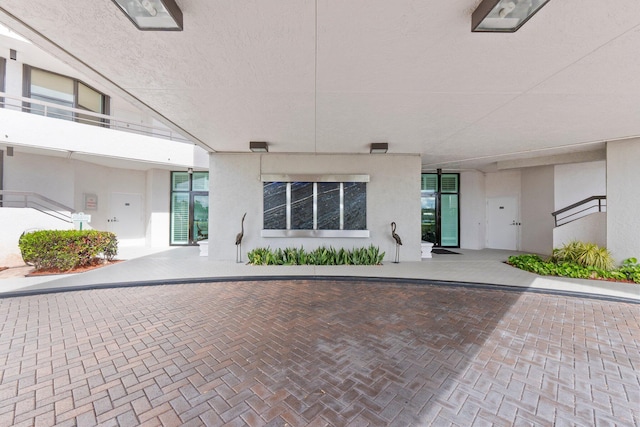 entrance to property with stucco siding