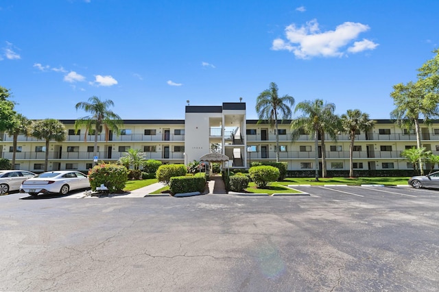 15244 Lakes Of Delray Blvd Unit 203, Delray Beach, FL 33484 - view of apartment building / complex featuring uncovered parking