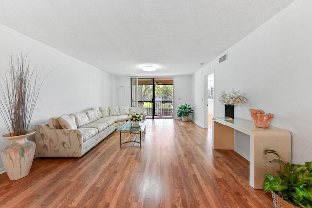 15244 Lakes Of Delray Blvd Unit 203, Delray Beach, FL 33484 - living area with wood finished floors