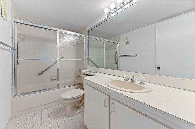 15244 Lakes Of Delray Blvd Unit 203, Delray Beach, FL 33484 - full bathroom with tile patterned floors, toilet, vanity, and shower / bath combination with glass door