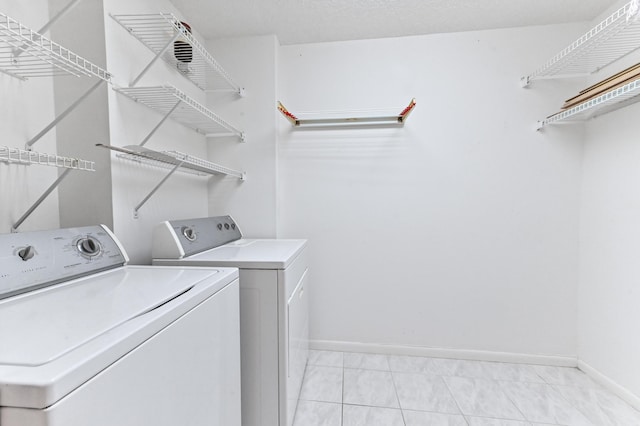 15244 Lakes Of Delray Blvd Unit 203, Delray Beach, FL 33484 - clothes washing area featuring washer and dryer and baseboards