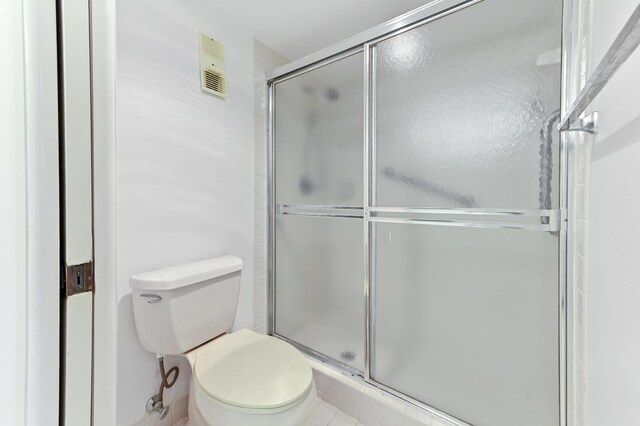 15244 Lakes Of Delray Blvd Unit 203, Delray Beach, FL 33484 - bathroom featuring a stall shower and toilet