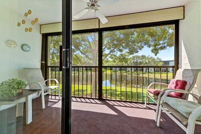15244 Lakes Of Delray Blvd Unit 203, Delray Beach, FL 33484 - sunroom featuring ceiling fan and a water view