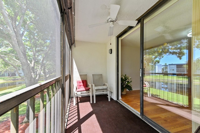 15244 Lakes Of Delray Blvd Unit 203, Delray Beach, FL 33484 - sunroom / solarium featuring a ceiling fan, a water view, and healthy amount of natural light