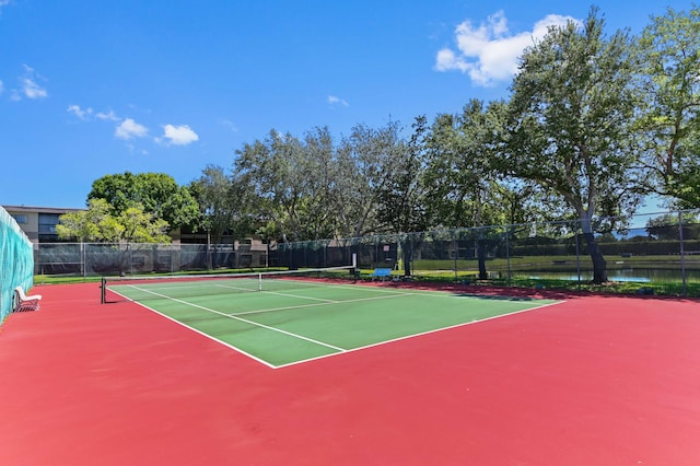 15244 Lakes Of Delray Blvd Unit 203, Delray Beach, FL 33484 - view of tennis court with community basketball court, fence, and a water view
