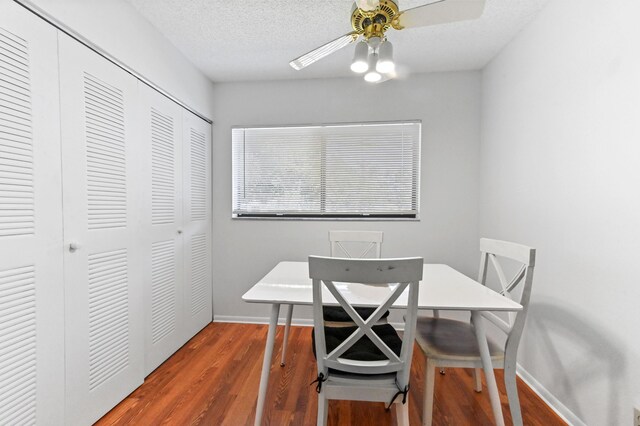 15244 Lakes Of Delray Blvd Unit 203, Delray Beach, FL 33484 - dining room with wood finished floors, baseboards, and a ceiling fan