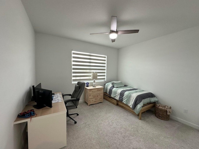 10230 SW Orana Dr, Port Saint Lucie, FL 34987 - bedroom featuring light colored carpet, a desk, baseboards, and ceiling fan