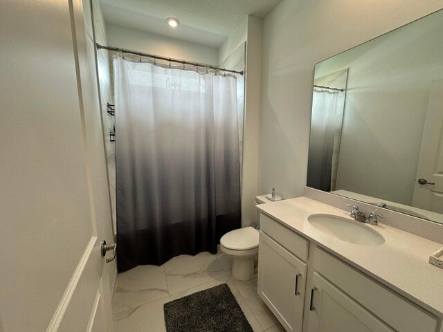 10230 SW Orana Dr, Port Saint Lucie, FL 34987 - bathroom featuring marble look tile flooring, vanity, toilet, a shower with shower curtain, and recessed lighting