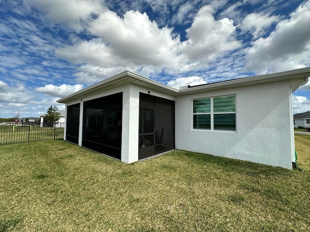 10230 SW Orana Dr, Port Saint Lucie, FL 34987 - back of house with stucco siding and a sunroom