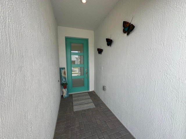 10230 SW Orana Dr, Port Saint Lucie, FL 34987 - view of exterior entry with stucco siding