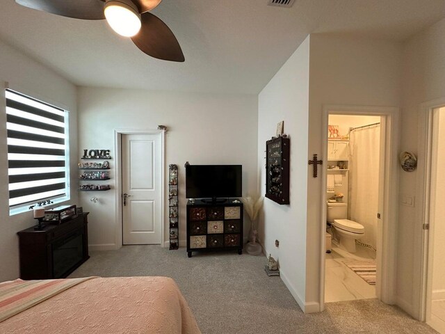 10230 SW Orana Dr, Port Saint Lucie, FL 34987 - bedroom featuring carpet flooring, connected bathroom, baseboards, and a ceiling fan