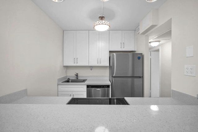 5821 Washington St Unit 21, Hollywood, FL 33023 - kitchen with stainless steel appliances, a sink, and white cabinetry