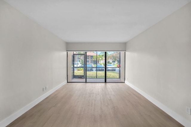 5821 Washington St Unit 21, Hollywood, FL 33023 - empty room featuring baseboards and wood finished floors