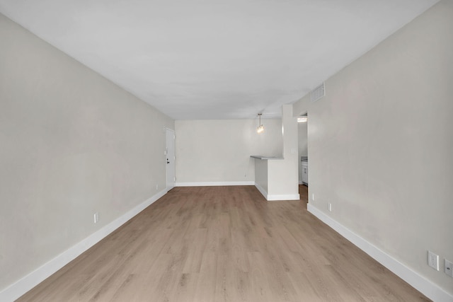 5821 Washington St Unit 21, Hollywood, FL 33023 - unfurnished living room featuring wood finished floors and baseboards