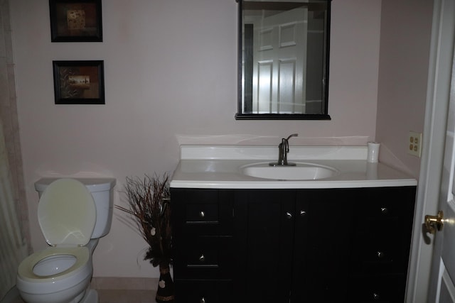 half bathroom with toilet and vanity
