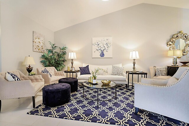 tiled living area with lofted ceiling
