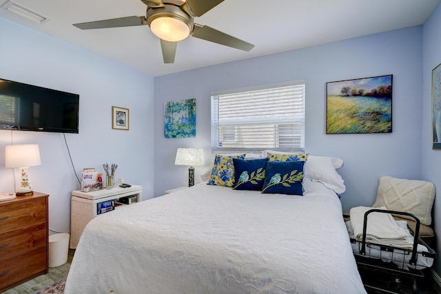 bedroom featuring ceiling fan and visible vents