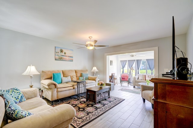 living room featuring wood finished floors and ceiling fan