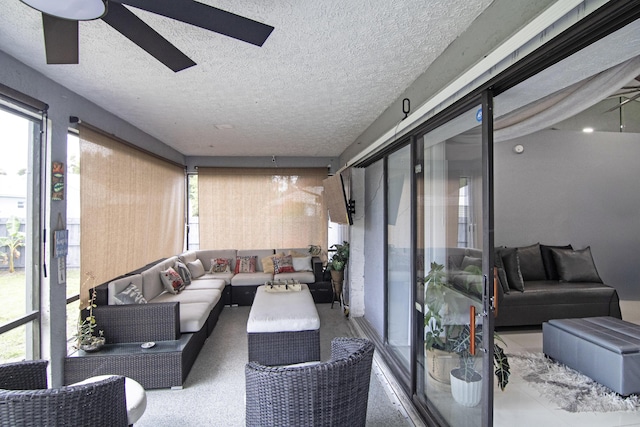 exterior space featuring a wealth of natural light, a ceiling fan, and an outdoor living space