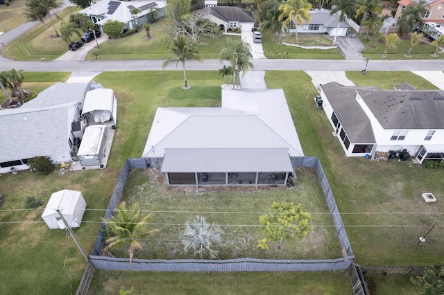 birds eye view of property with a residential view