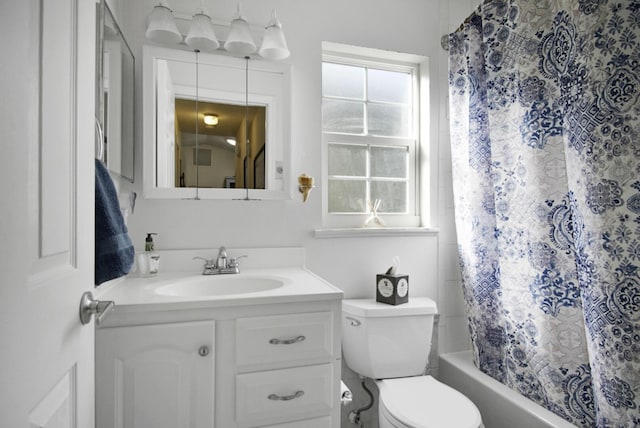 full bath with toilet, vanity, and shower / bathtub combination with curtain