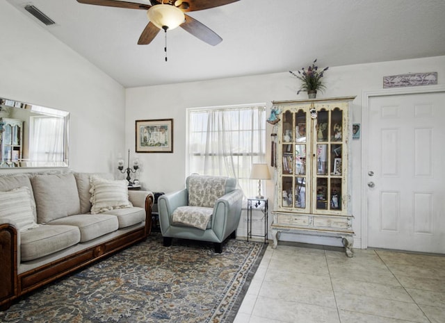 tiled living room featuring a ceiling fan
