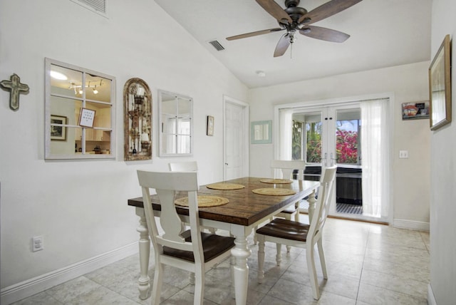dining space featuring lofted ceiling, ceiling fan, baseboards, french doors, and light tile patterned flooring