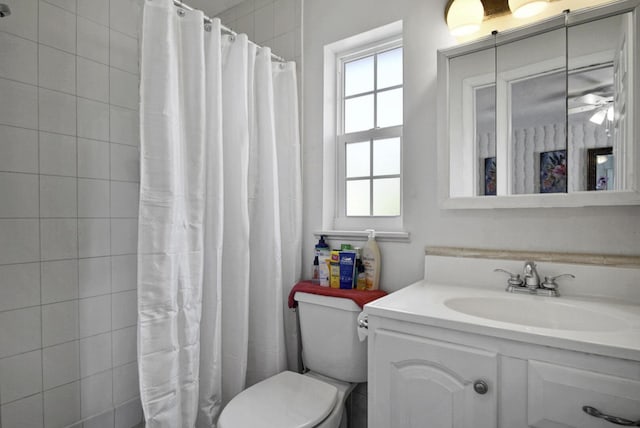 full bath featuring toilet, a shower with curtain, and vanity