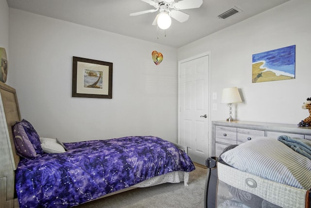 carpeted bedroom featuring a ceiling fan