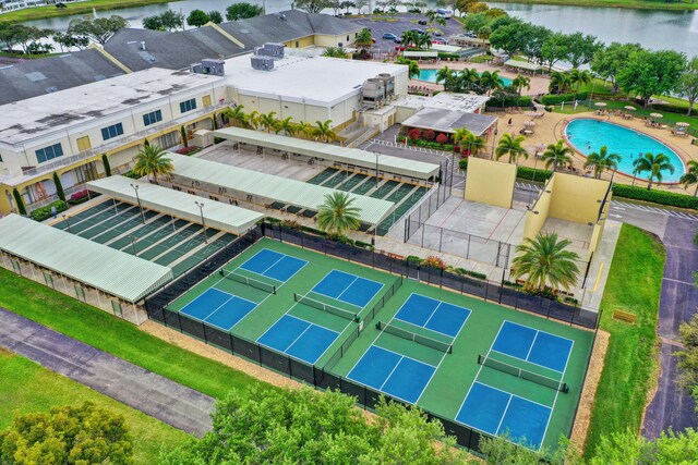 bird's eye view of a nearby body of water and a pool