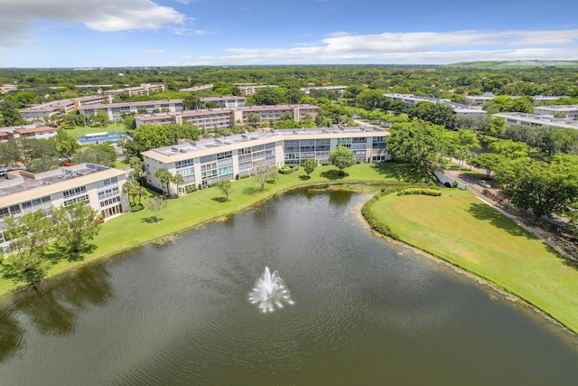 bird's eye view of apartment complex and a nearby body of water