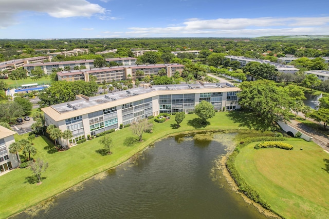bird's eye view of apartment complex and a nearby body of water