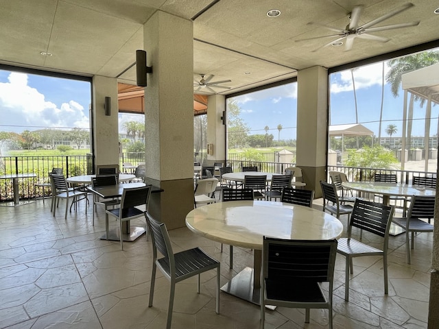 view of patio / terrace featuring outdoor dining area, a ceiling fan, and fence